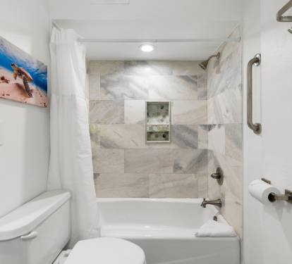 Gorgeous tile in the primary en-suite bathroom. Bath/Shower combo