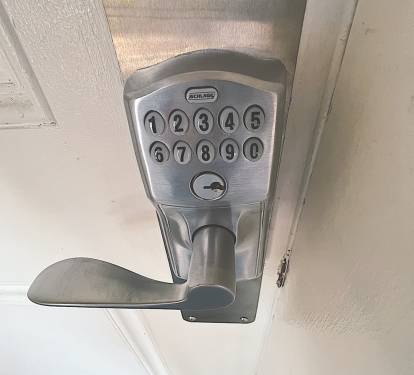 Keyless entry system with a unique code that activates / deactivates for safety.
