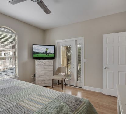 King bedroom with private balcony access and Smart TV