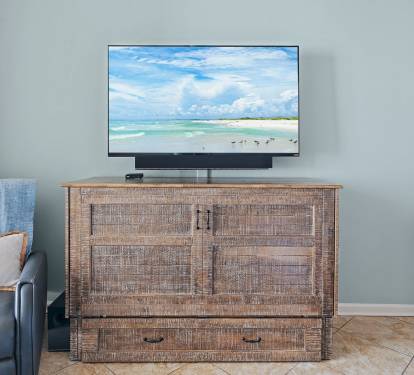 Kick back and enjoy your favorite shows on the flat-screen TV.