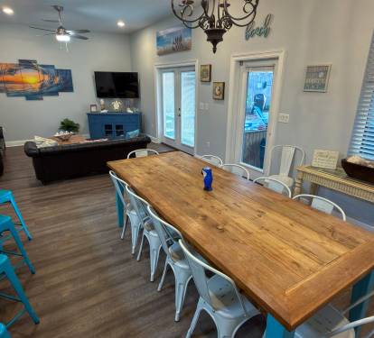 Gather, dine, and unwind with a layout that connects seamlessly to the screened-in patio and tropical poolside retreat.