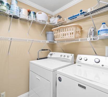 Large laundry room with full size washer and dryer