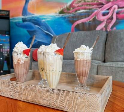 Milkshakes, Pac-Man, and a kraken on the wall — this is the fun room.