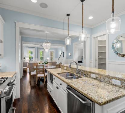 Chef-friendly kitchen w/ gas range, generous counter space & sightlines into the dining room.