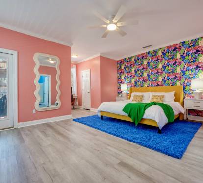 Upstairs master bedroom. King size bed. Large spacious room with private closet, bathroom, and entrance to balcony.