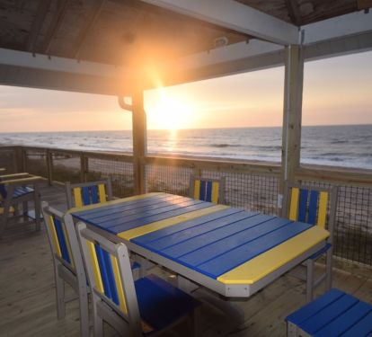 Enjoy a meal at the large table on the partially c