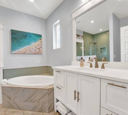 Primary bedroom bathroom suite with large soaking tub