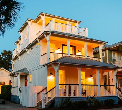 The property glows at night — a glimpse of the ambiance waiting for your group after a day on 30A.