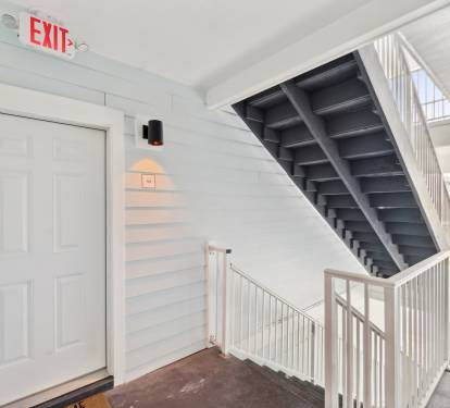 A single staircase leading up to the unit