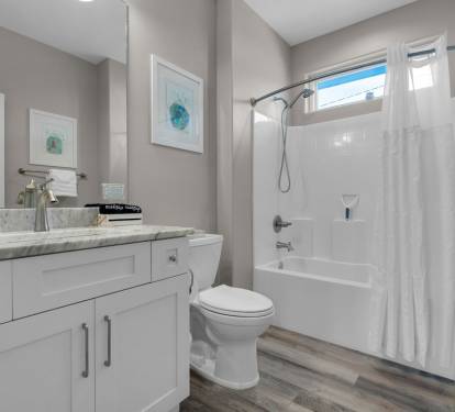 Third Bathroom with convenient tub and shower combination for the kids. 