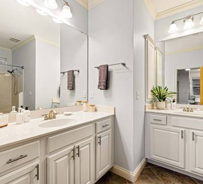 No morning jostling. The ensuite master bath has two separate vanities so you can both get ready at once.