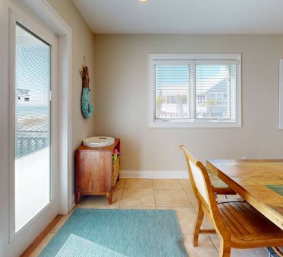 Dining windows overlook pool area.