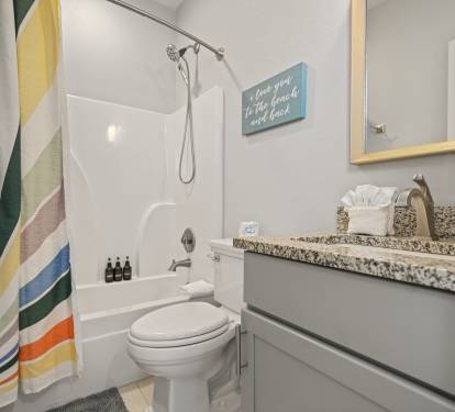 Double Queen Suite ensuite bathroom with granite vanity and shower/tub combination.