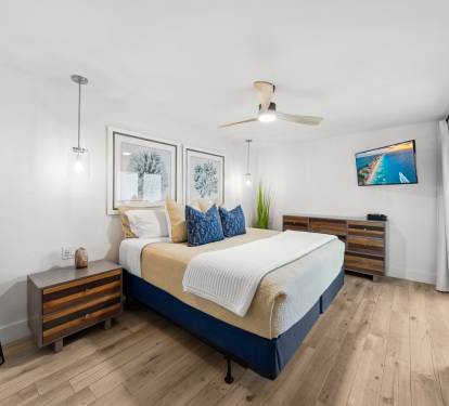 Primary Suite with a king bed, en suite bath, washer and dryer, TV, patio access and Gulf views!