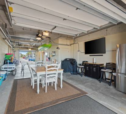 Garage With TV & Extra Fridge