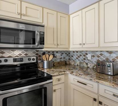 Additional kitchen view highlighting storage, workspace & open flow.