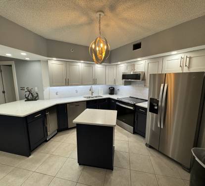 Newly remodeled Coastal Kitchen features all new Whirlpool stainless appliances including ice maker, dishwasher, sink, faucet, oven, microwave and refrigerator.