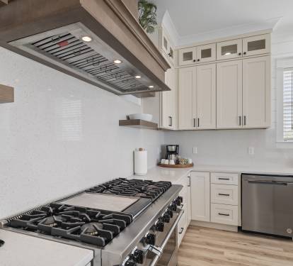Fully equipped kitchen with a professional 48-inch range and built-in oven.
