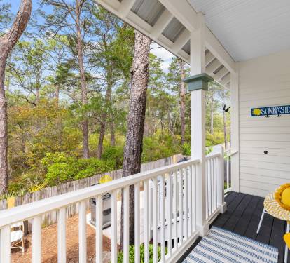 Enjoy our wooded backyard view from the back porch.