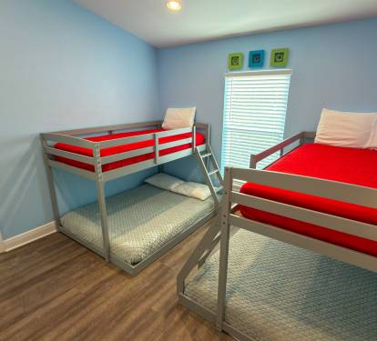 With sleeping space for multiple guests, this lively bunk room is made for movie nights, card games, and memorable family vacations.