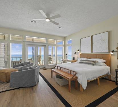 3rd floor primary bedroom with ocean view and king bed