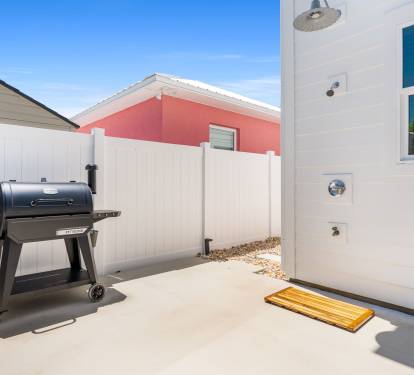 Let the designated BBQ master work their magic on the grill while you enjoy a drink in the shade.