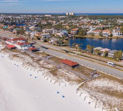 Aerial view of the area showcasing the neighborhood and coastline