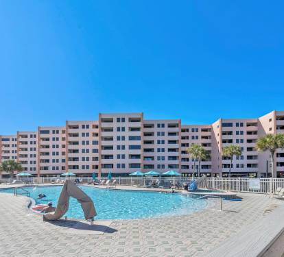 Expansive pool area set between the condos for sunny afternoons.