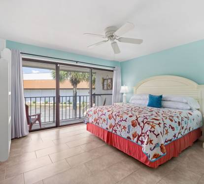 Bedroom 3, King with twin bunks, full bath & balcony access.
