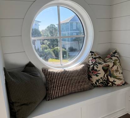 A cozy porthole perch—perfect for a quiet moment.  Gather when you want to, retreat when you need to. From porch swings and reading nooks to private bedrooms and loft hideaways, Magnolia Mooring offers a place for everyone.