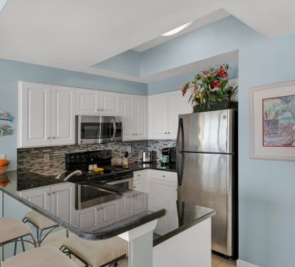 The kitchen features granite counters and Stainless steel appliances