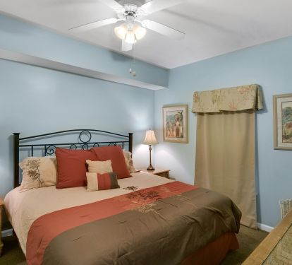 King bed in master bedroom with ensuite bath