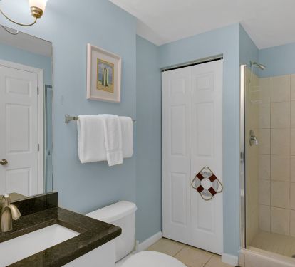 This condo has a guest bath with walk in shower