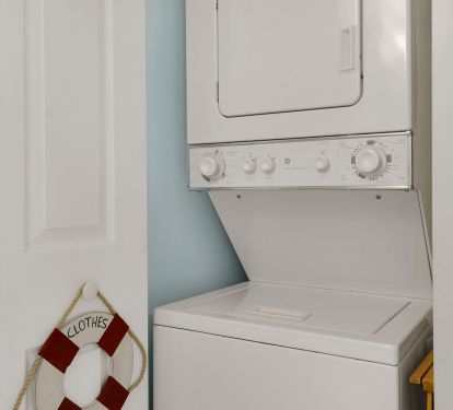 stackable washer/dryer in the unit located in closet in the guest bathroom
