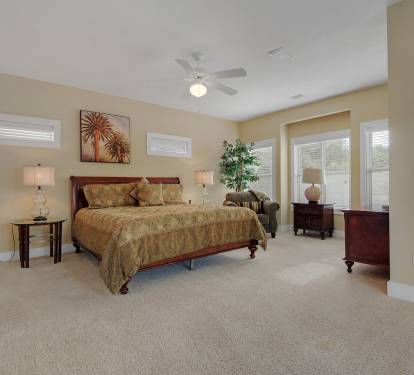 Master suite w/ king bed and a partial view of the Gulf