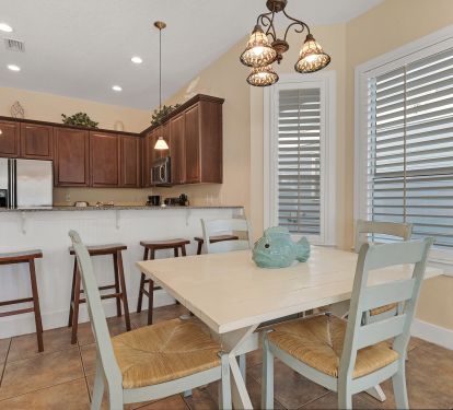 With 4 chairs and a bench you can seat at least 6 at the dining table 