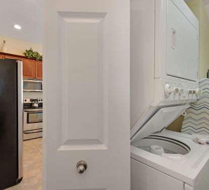 Laundry room has stackable washer/dryer