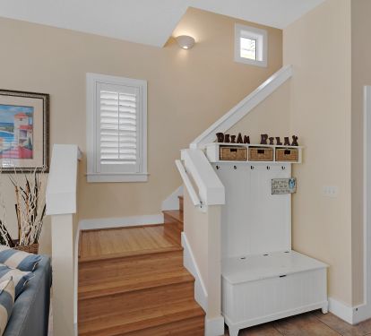 Stairway to second floor w/master and guest bedrooms 