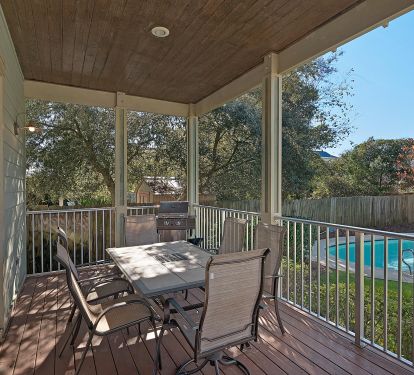 back deck has propane grill and patio set