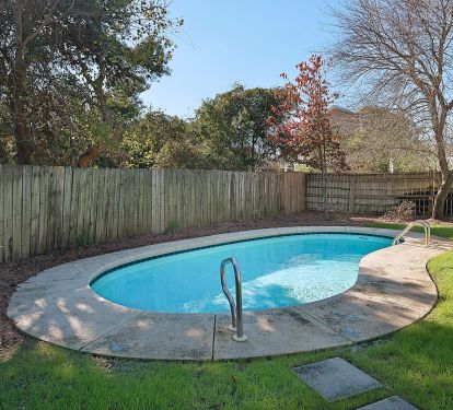 large back yard with in ground pool!