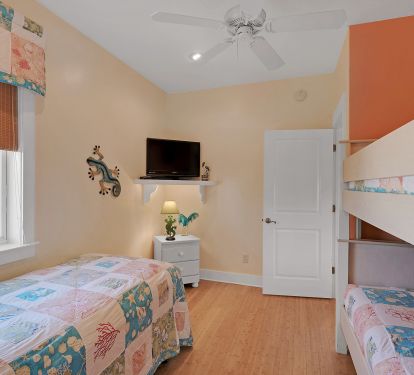 large flat screen tv in bunk room