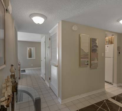 Entryway leads to galley kitchen or Living room to the right or bedrooms to the left