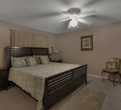King bed in master bedroom with ensuite bath