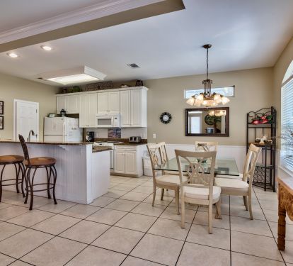 Large kitchen with eat-in counter and dining area