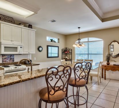 Large kitchen with eat-in counter and dining area