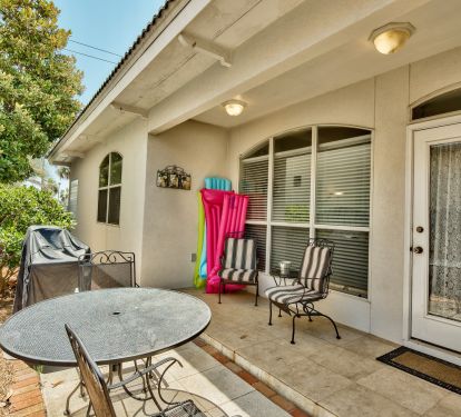 Outdoor patio with furniture and grill