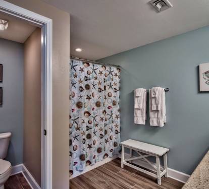 Master Suite (#1) - Private bath with double granite sinks and new tile plank flooring