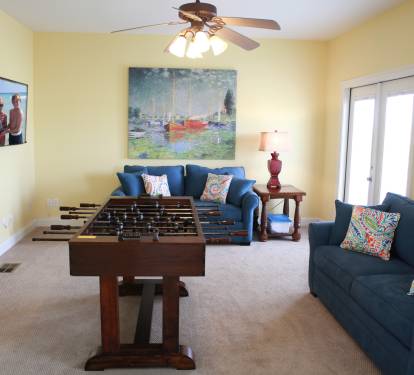 Game room on 3rd level with two full-size sleeper sofas