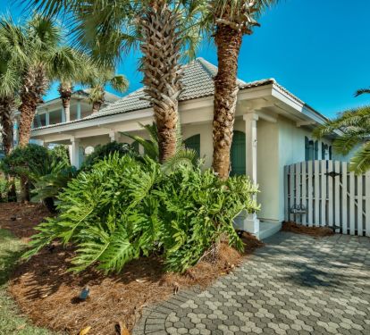 Hidden Gem by the Sea surrounded by lush tropical palms