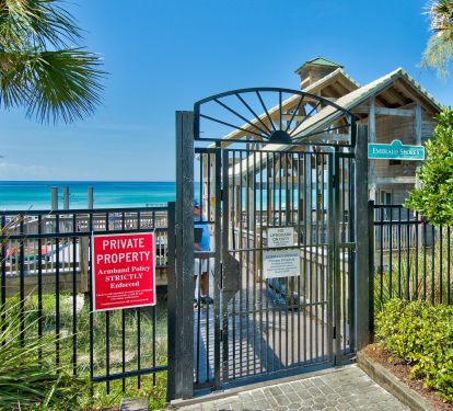 Private beach pavilion entrance with showers, rest rooms, rinse showers, wagon parking and  food bar during peak time